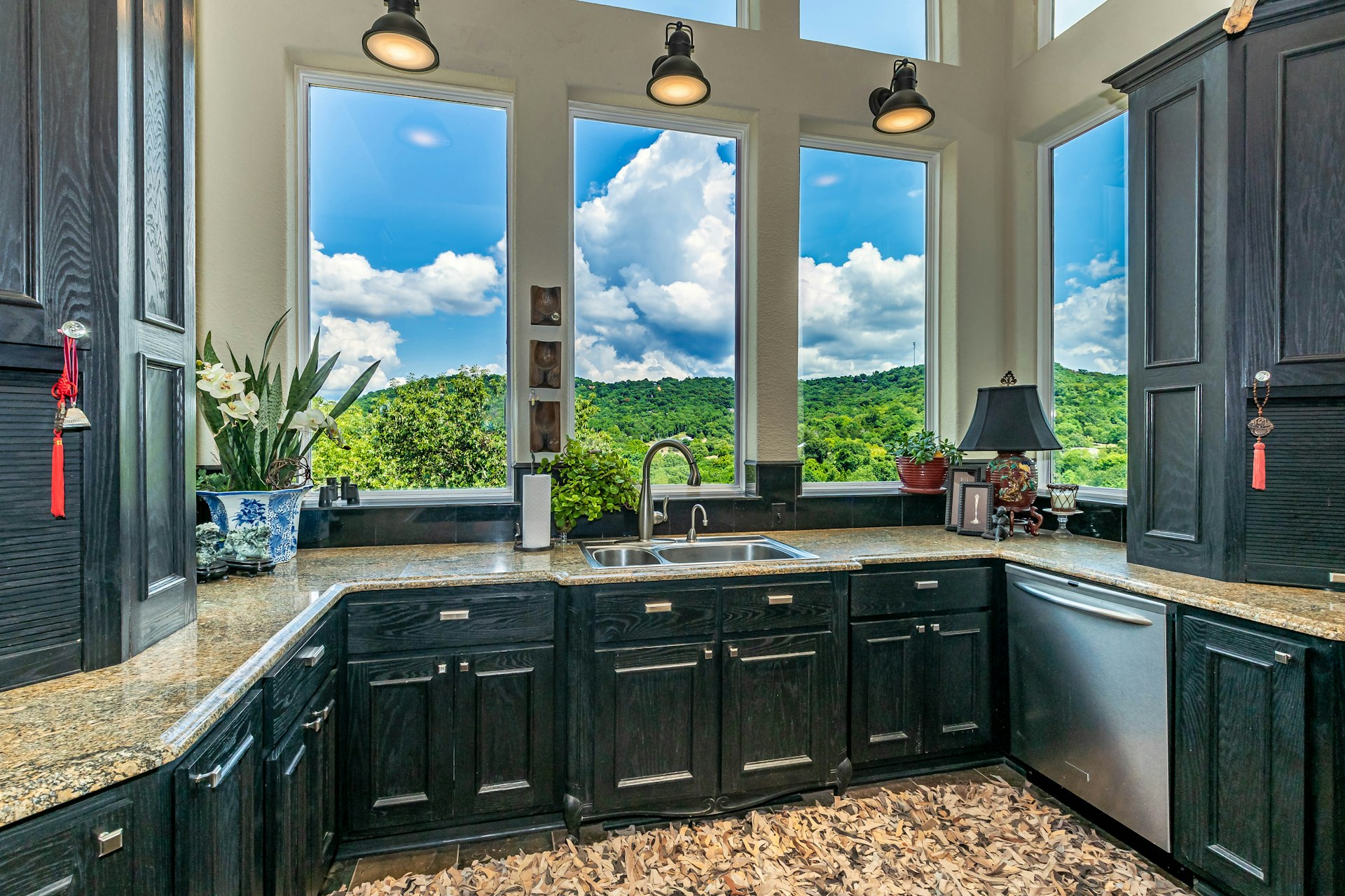 brown wooden kitchen cabinet near window